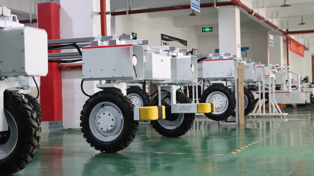 Can a Four Wheel Drive Robot Chassis Achieve Zero-Damage Farming in Tight Orchards?